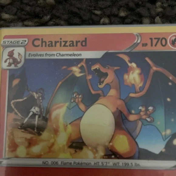 Pokemon Charizard Trading Card - Red and Yellow also has a sleeve - Picture 2 of 9